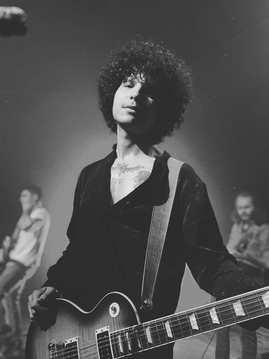 Batu Akdeniz on stage — black-and-white portrait